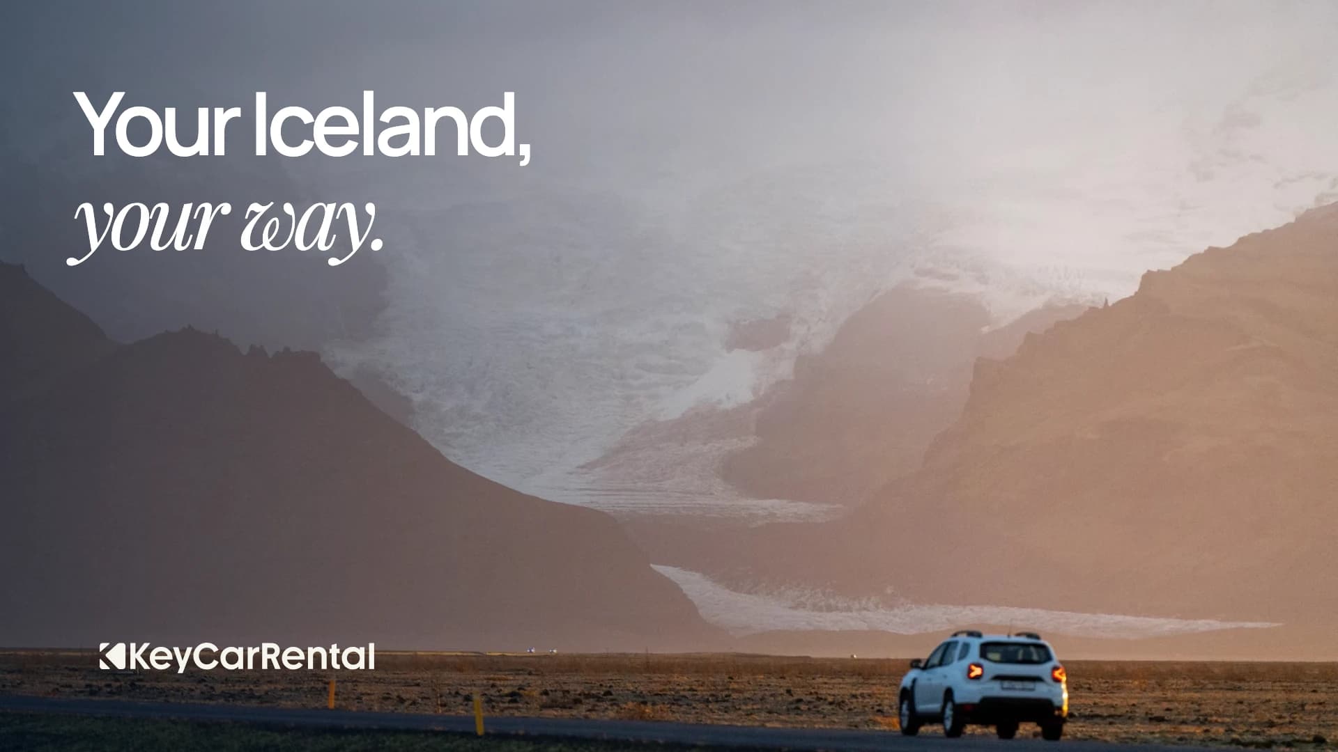 A car beneath a glacier in a misty Icelandic valley, with the Key brand line Your Iceland, your way