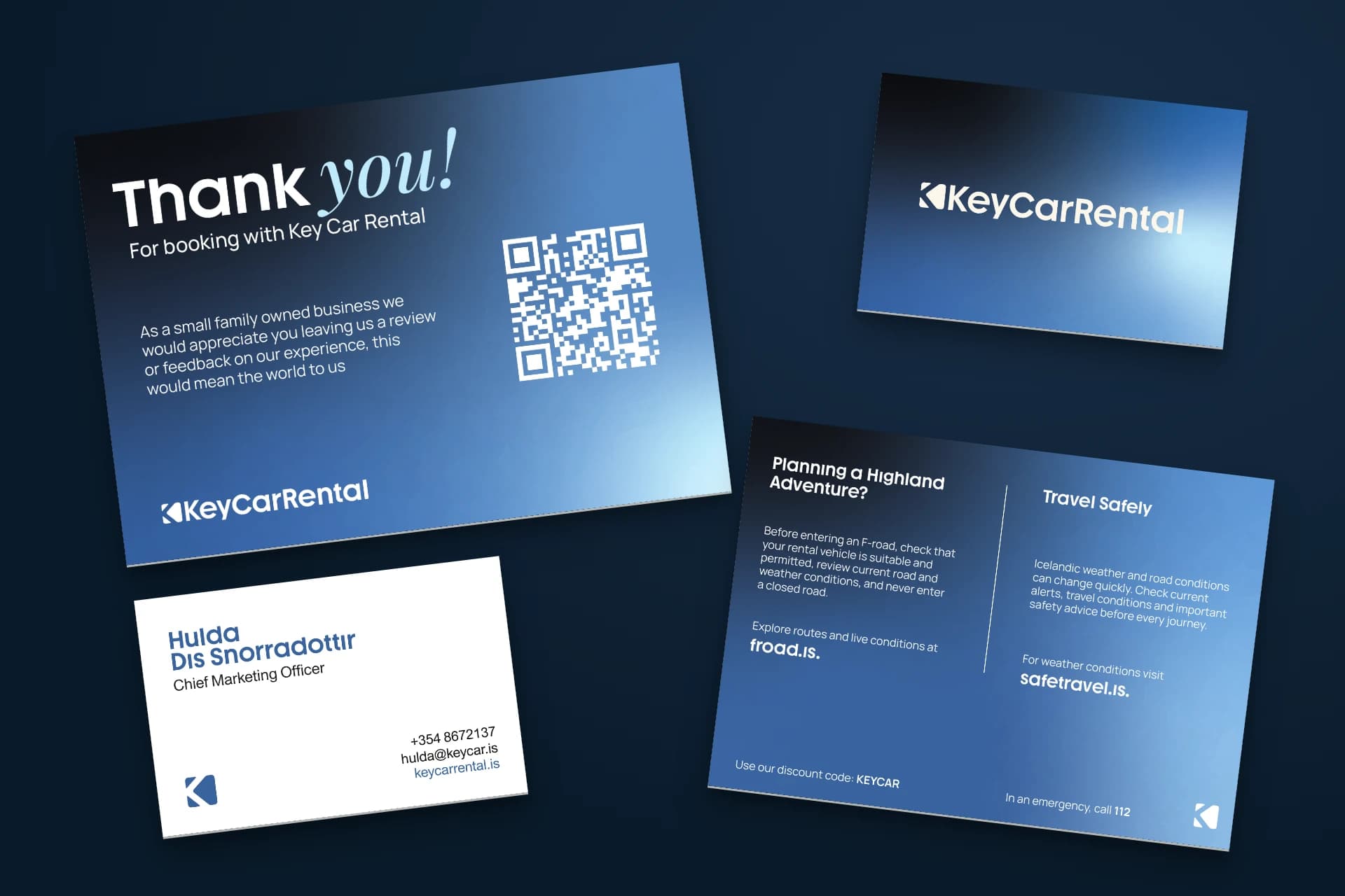 Original Key business cards and thank-you cards arranged on a deep blue surface